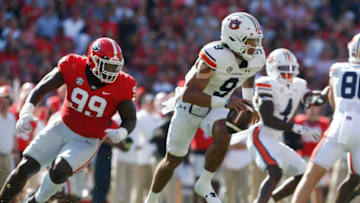 Auburn footballGeorgia Bulldogs defensive lineman Bear Alexander (99) chases down Auburn Tigers quarterback Robby Ashford (9) as Georgia takes on Auburn at Sanford Stadium in Athens, Ga. on Saturday, Oct. 8th, 2022.Sports Richard Hamm