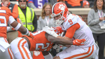 Apr 9, 2022; Clemson, South Carolina, USA; Orange squad cornerback Toriano Pride Jr. (23) tackles White squad tight end Jake Briningstool (9) during the first quarter of the 2022 Orange vs White Spring Game at Memorial Stadium. Mandatory Credit: Ken Ruinard-USA TODAY Sports