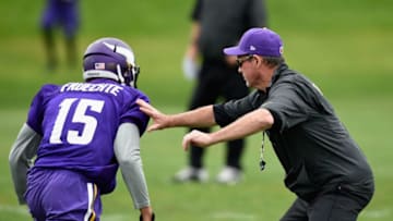 EDEN PRAIRIE, MN - JUNE 4: Head coach Mike Zimmer of the Minnesota Vikings blocks Isaac Fruechte