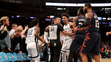 NEW YORK, NEW YORK - JANUARY 29: The referees try to break up a fight between Jae Crowder #99 of the Memphis Grizzlies and Elfrid Payton #6 of the New York Knicks as the benches clear in the final minute of the game at Madison Square Garden on January 29, 2020 in New York City.The Memphis Grizzlies defeated the New York Knicks 127-106.NOTE TO USER: User expressly acknowledges and agrees that, by downloading and or using this photograph, User is consenting to the terms and conditions of the Getty Images License Agreement. (Photo by Elsa/Getty Images)