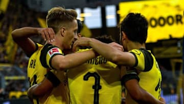 Dortmund's forward Marco Reus (L) celebrates with teammates after he scored the team's fourth goal during the German first division Bundesliga football match Borussia Dortmund v RB Leipzig in Dortmund, western Germany, on August 26, 2018. (Photo by SASCHA SCHUERMANN / AFP) / RESTRICTIONS: DFL REGULATIONS PROHIBIT ANY USE OF PHOTOGRAPHS AS IMAGE SEQUENCES AND/OR QUASI-VIDEO (Photo credit should read SASCHA SCHUERMANN/AFP/Getty Images)