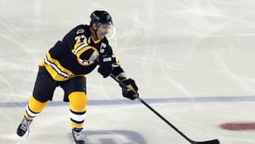 Dec 31, 2015; Foxborough, MA, USA; Boston Bruins defenseman Ray Bourque (77) passes the puck during the Winter Classic alumni hockey game against the Montreal Canadiens at Gillette Stadium. Mandatory Credit: Bob DeChiara-USA TODAY Sports