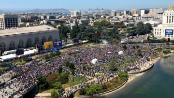 OAKLAND, CA - JUNE 15: A large crowd gathers to watch the Golden State Warriors victory parade and rally on June 15, 2017 in dowtown Oakland, California. An estimated crowd of over 1 million people came out to cheer on the Warriors during their victory parade after winning the 2017 NBA Championship. NOTE TO USER: User expressly acknowledges and agrees that, by downloading and or using this photograph, User is consenting to the terms and conditions of the Getty Images License Agreement. (Photo by Jake Lawrence/Getty Images)