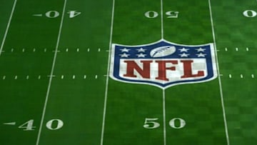 Jan 23, 2015; Glendale, AZ, USA; General view of NFL shield logo at midfield of University of Phoenix Stadium in advance of Super Bowl XLIX between the Seattle Seahawks and the New England Patriots. Mandatory Credit: Kirby Lee-USA TODAY Sports