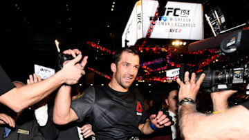 LAS VEGAS, NEVADA - DECEMBER 12: UFC middleweight champion Luke Rockhold celebrates withs fans after defeating Chris Weidman in their middleweight championship bout during the UFC 194 event inside MGM Grand Garden Arena on December 12, 2015 in Las Vegas, Nevada. (Photo by Jeff Bottari/Zuffa LLC/Zuffa LLC via Getty Images)