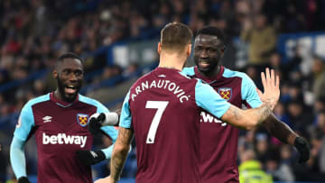 HUDDERSFIELD, ENGLAND - JANUARY 13: Marko Arnautovic of West Ham United celebrates after scoring his sides second goal with his team mates during the Premier League match between Huddersfield Town and West Ham United at John Smith's Stadium on January 13, 2018 in Huddersfield, England. (Photo by Gareth Copley/Getty Images)