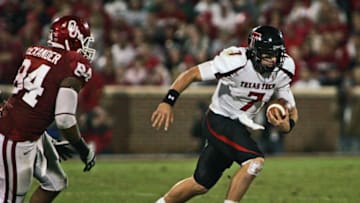 NORMAN, OK - OCTOBER 22: Quarterback Seth Doege #7 of Texas Tech scrambles away from defensive end Frank Alexander #84 of Oklahoma in the second half at at Gaylord Family-Oklahoma Memorial Stadium on October 22, 2011 in Norman, Oklahoma. Oklahoma was upset by Texas Tech 41-38. (Photo by Brett Deering/Getty Images)