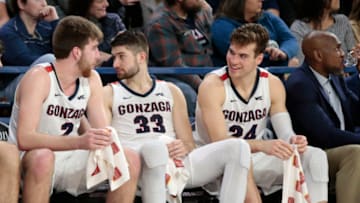 SPOKANE, WASHINGTON - JANUARY 16: Drew Timme #2, Killian Tillie #33 and Corey Kispert #24 of the Gonzaga Bulldogs look on from the bench in the second half against the Santa Clara Broncos at McCarthey Athletic Center on January 16, 2020 in Spokane, Washington. Gonzaga defeats Santa Clara 104-54. (Photo by William Mancebo/Getty Images)