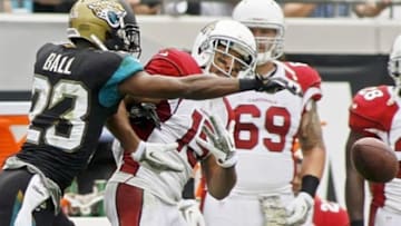 Nov 17, 2013; Jacksonville, FL, USA; Jacksonville Jaguars cornerback Alan Ball (23) deflects a pass to Arizona Cardinals wide receiver Michael Floyd (15) in the second quarter of their game at EverBank Field. Mandatory Credit: Phil Sears-USA TODAY Sports
