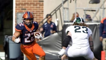 Nov 5, 2016; Champaign, IL, USA; Illinois Fighting Illini running back Kendrick Foster (22) defended by Michigan State Spartans linebacker Chris Frey (23) during the fourth quarter at Memorial Stadium. Illinois beat Michigan State 31-27. Mandatory Credit: Mike Granse-USA TODAY Sports