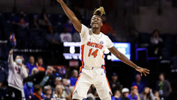 GAINESVILLE, FLORIDA - DECEMBER 22: Kowacie Reeves #14 of the Florida Gators gestures during the first half of a game against the Stony Brook Seawolves at the Stephen C. O'Connell Center on December 22, 2021 in Gainesville, Florida. (Photo by James Gilbert/Getty Images)