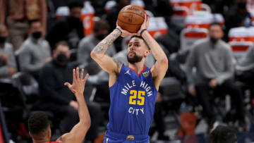 DENVER, COLORADO - MAY 22: Austin Rivers #25 of the Denver Nuggets puts up a shot against CJ McCollum #3 of the Portland Trail Blazers in the first quarter during Game One of their Western Conference first-round playoff series at Ball Arena on May 22, 2021 in Denver, Colorado. NOTE TO USER: User expressly acknowledges and agrees that, by downloading and or using this photograph, User is consenting to the terms and conditions of the Getty Images License Agreement. (Photo by Matthew Stockman/Getty Images)