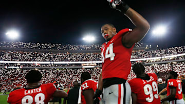 Georgia inside linebacker Channing Tindall celebrates as Georgia fans light up Sanford Stadium. (Photo By: Joshua L. Jones/Athens Banner-Herald via USA TODAY NETWORK)