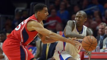 Jan 5, 2015; Los Angeles, CA, USA; Los Angeles Clippers guard Jamal Crawford (11) is defended by Atlanta Hawks forward Thabo Seflosha (25) at Staples Center. Mandatory Credit: Kirby Lee-USA TODAY Sports