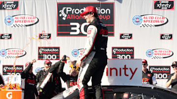 FONTANA, CALIFORNIA - FEBRUARY 29: Harrison Burton, driver of the #20 Dex Imaging Toyota, celebrates in Victory Lane after winning the NASCAR Xfinity Series Production Alliance Group 300 at Auto Club Speedway on February 29, 2020 in Fontana, California. (Photo by Katelyn Mulcahy/Getty Images)