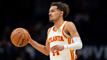 CHARLOTTE, NORTH CAROLINA - JANUARY 23: Trae Young #11 of the Atlanta Hawks brings the ball up court against the Charlotte Hornets during their game at Spectrum Center on January 23, 2022 in Charlotte, North Carolina. NOTE TO USER: User expressly acknowledges and agrees that, by downloading and or using this photograph, User is consenting to the terms and conditions of the Getty Images License Agreement. (Photo by Jacob Kupferman/Getty Images)
