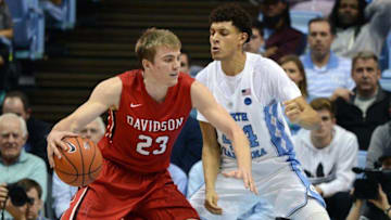 Dec 7, 2016; Chapel Hill, NC, USA; Davidson Wildcats forward Peyton Aldridge (23) drives to the basket as North Carolina Tar Heels forward Justin Jackson (44) defends during the second half at Dean E. Smith Center. The Tar Heels won 83-74. Mandatory Credit: Rob Kinnan-USA TODAY Sports