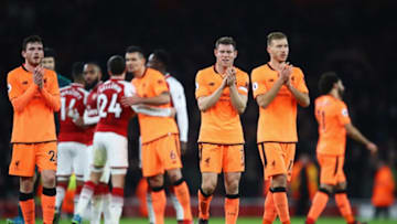 LONDON, ENGLAND - DECEMBER 22: James Milner and Ragnar Klavan of Liverpool applaud the travelling fans after the Premier League match between Arsenal and Liverpool at Emirates Stadium on December 22, 2017 in London, England. (Photo by Julian Finney/Getty Images)