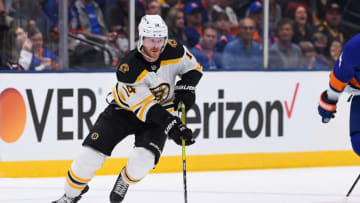 Jun 5, 2021; Uniondale, New York, USA; Boston Bruins right wing Chris Wagner (14) skates with the puck against the New York Islanders during the first period in game four of the second round of the 2021 Stanley Cup Playoffs at Nassau Veterans Memorial Coliseum. Mandatory Credit: Dennis Schneidler-USA TODAY Sports