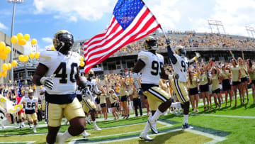 ATLANTA, GA - SEPTEMBER 17: P. J. Davis #40, Tyler Meriweather #95, and Brentavious Glanton #97 of the Georgia Tech Yellow Jackets take the field against the Vanderbilt Commodores at Bobby Dodd Stadium on September 17, 2016 in Atlanta, Georgia. (Photo by Scott Cunningham/Getty Images)