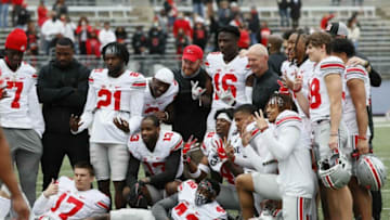 Kerry Coombs poses for a photo with the defensive backs following the Ohio State Buckeyes football spring game at Ohio Stadium in Columbus on Saturday, April 17, 2021.Ohio State Football Spring Game