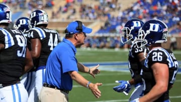 Oct 1, 2016; Durham, NC, USA; Duke Blue Devils head coach David Cutcliffe greets his players as they come off the field after a Virginia Cavaliers touchdown in the first half at Wallace Wade Stadium. Mandatory Credit: Mark Dolejs-USA TODAY Sports