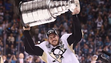Jun 12, 2016; San Jose, CA, USA; Pittsburgh Penguins center Sidney Crosby (87) hoists the Stanley Cup after defeating the San Jose Sharks in game six of the 2016 Stanley Cup Final at SAP Center at San Jose. Mandatory Credit: Gary A. Vasquez-USA TODAY Sports