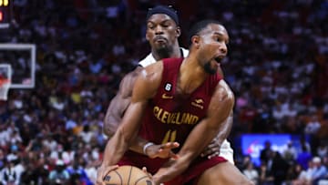 MIAMI, FLORIDA - MARCH 08: Evan Mobley #4 of the Cleveland Cavaliers drives against Jimmy Butler #22 of the Miami Heat during the first quarter of the game at Miami-Dade Arena on March 08, 2023 in Miami, Florida. NOTE TO USER: User expressly acknowledges and agrees that, by downloading and or using this photograph, User is consenting to the terms and conditions of the Getty Images License Agreement. (Photo by Megan Briggs/Getty Images)
