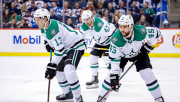 WINNIPEG, MB - MARCH 25: Mattias Janmark #13, Alexander Radulov #47 and Roman Polak #45 of the Dallas Stars get set during a first period face-off against the Winnipeg Jets at the Bell MTS Place on March 25, 2019 in Winnipeg, Manitoba, Canada. (Photo by Darcy Finley/NHLI via Getty Images)