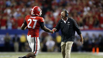 Sep 3, 2016; Atlanta, GA, USA; Georgia Bulldogs running back Nick Chubb (27) celebrates with head coach Kirby Smart after running for a touchdown against the North Carolina Tar Heels during the fourth quarter of the 2016 Chick-Fil-A Kickoff game at Georgia Dome. Mandatory Credit: Brett Davis-USA TODAY Sports