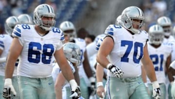 Aug 7, 2014; San Diego, CA, USA; Dallas Cowboys tackle Doug Free (68) and guard Zack Martin (70) warm-up before the game against the San Diego Chargers at Qualcomm Stadium. Mandatory Credit: Jake Roth-USA TODAY Sports