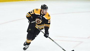 BOSTON, MA - APRIL 19: John Moore #27 of the Boston Bruins skates with the puck against the Toronto Maple Leafs in Game Five of the Eastern Conference First Round during the 2019 NHL Stanley Cup Playoffs at the TD Garden on April 19, 2019 in Boston, Massachusetts. (Photo by Steve Babineau/NHLI via Getty Images)
