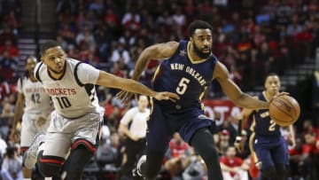 Dec 16, 2016; Houston, TX, USA; New Orleans Pelicans forward Reggie Williams (5) dribbles the ball on a fast break as Houston Rockets guard Eric Gordon (10) defends during the first quarter at Toyota Center. Mandatory Credit: Troy Taormina-USA TODAY Sports