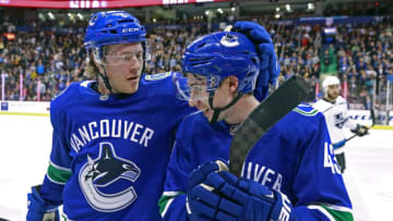 VANCOUVER, BC - MARCH 28: Brock Boeser #6 of the Vancouver Canucks is congratulated by teammate Quinn Hughes #43 after scoring during their NHL game against the Los Angeles Kings at Rogers Arena March 28, 2019 in Vancouver, British Columbia, Canada. (Photo by Jeff Vinnick/NHLI via Getty Images)