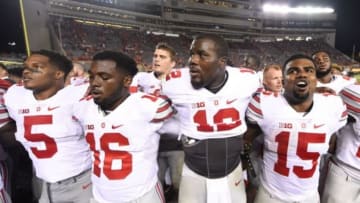 Sep 7, 2015; Blacksburg, VA, USA; Ohio State Buckeyes linebacker Raekwon McMillan (5) and quarterback J.T. Barrett (16) and quarterback Cardale Jones (12) and running back Ezekiel Elliott (15) after the game. The Ohio State Buckeyes defeated the Virginia Tech Hokies 42-24 at Lane Stadium. Mandatory Credit: Bob Donnan-USA TODAY Sports