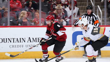 GLENDALE, ARIZONA - OCTOBER 10: Nick Schmaltz #8 of the Arizona Coyotes skates with the puck ahead of Jon Merrill #15 of the Vegas Golden Knights during the third period of the NHL game at Gila River Arena on October 10, 2019 in Glendale, Arizona. The Coyotes defeated the Golden Knights 4-1. (Photo by Christian Petersen/Getty Images)