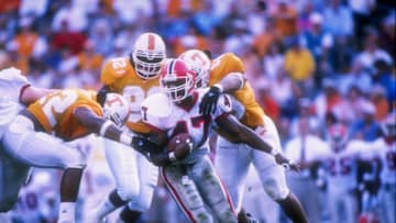 11 Oct 1997: Defensive end Corey Terry of the Tennessee Volunteers (left) reaches out to tackle running back Robert Edwards of the Georgia Bulldogs (center) during a game at Neyland Stadium in Knoxville, Tennessee. Tennessee won the game 38-13. Mandatory Credit: Craig Jones /Allsport