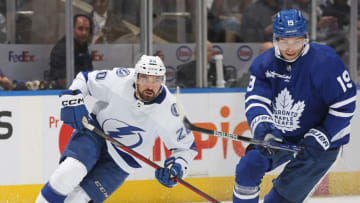 TORONTO, CANADA - APRIL 18: Nicholas Paul #20 of the Tampa Bay Lightning skates for the puck against Calle Jarnkrok #19 of the Toronto Maple Leafs during Game One of the First Round of the 2023 Stanley Cup Playoffs at Scotiabank Arena on April 18, 2023 in Toronto, Ontario, Canada. (Photo by Claus Andersen/Getty Images)