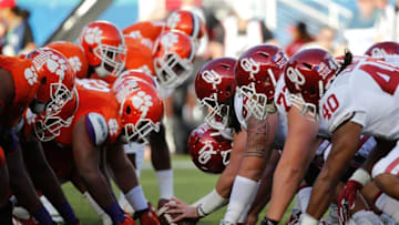 Dec 31, 2015; Miami Gardens, FL, USA;Clemson Tigers and Oklahoma Sooners line up in the first quarter of the 2015 CFP Semifinal at the Orange Bowl at Sun Life Stadium. Mandatory Credit: Kim Klement-USA TODAY Sports