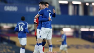 Everton's English midfielder Ben Godfrey and Everton's English defender Michael Keane celebrate after the English Premier League football match between Everton and Southampton at Goodison Park in Liverpool, north west England on March 1, 2021. - Everton won the game 1-0. (Photo by Clive Brunskill / POOL / AFP) / RESTRICTED TO EDITORIAL USE. No use with unauthorized audio, video, data, fixture lists, club/league logos or 'live' services. Online in-match use limited to 120 images. An additional 40 images may be used in extra time. No video emulation. Social media in-match use limited to 120 images. An additional 40 images may be used in extra time. No use in betting publications, games or single club/league/player publications. / (Photo by CLIVE BRUNSKILL/POOL/AFP via Getty Images)