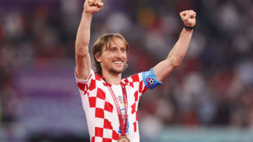 DOHA, QATAR - DECEMBER 17: Luka Modric of Croatia celebrates with his bronze medal after the FIFA World Cup Qatar 2022 3rd Place match between Croatia and Morocco at Khalifa International Stadium on December 17, 2022 in Doha, Qatar. (Photo by Alex Livesey - Danehouse/Getty Images)