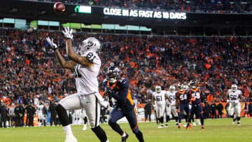 Dec 13, 2015; Denver, CO, USA; Oakland Raiders tight end Mychal Rivera (81) catches a touchdown pass as Denver Broncos free safety Darian Stewart (26) fails on the coverage during the second half at Sports Authority Field at Mile High. The Raiders won 15-12. Mandatory Credit: Chris Humphreys-USA TODAY Sports
