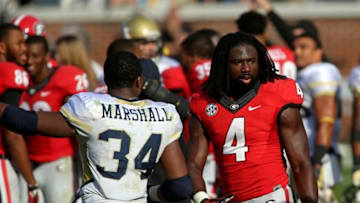 Nov 28, 2015; Atlanta, GA, USA; Georgia Tech Yellow Jackets running back Marcus Marshall (34) greets Georgia Bulldogs running back Keith Marshall (4) after their game at Bobby Dodd Stadium. The Bulldogs won 13-7. Mandatory Credit: Jason Getz-USA TODAY Sports