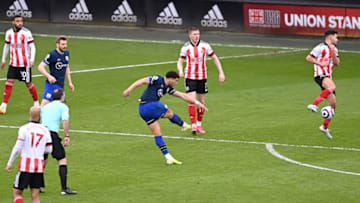 SHEFFIELD, ENGLAND - MARCH 06: Che Adams of Southampton scores his team's second goal during the Premier League match between Sheffield United and Southampton at Bramall Lane on March 06, 2021 in Sheffield, England. Sporting stadiums around the UK remain under strict restrictions due to the Coronavirus Pandemic as Government social distancing laws prohibit fans inside venues resulting in games being played behind closed doors. (Photo by Laurence Griffiths/Getty Images)