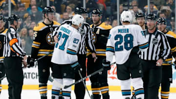 BOSTON, MA - OCTOBER 26: San Jose Sharks left wing Joonas Donskoi (27) is held back from Boston Bruins center David Backes (42) by linesman Matt McPherson (83) during a game between the Boston Bruins and the San Jose Sharks on October 26, 2017, at TD Garden in Boston, Massachusetts. The Bruins defeated the Sharks 2-1. (Photo by Fred Kfoury III/Icon Sportswire via Getty Images)