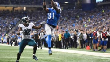 Nov 26, 2015; Detroit, MI, USA; Detroit Lions wide receiver Calvin Johnson (81) scores a touchdown while being pressured by Philadelphia Eagles cornerback Eric Rowe (32) during the second quarter of a NFL game on Thanksgiving at Ford Field. Mandatory Credit: Tim Fuller-USA TODAY Sports