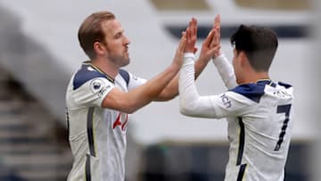 Tottenham Hotspur's English striker Harry Kane (L) celebrates with Tottenham Hotspur's South Korean striker Son Heung-Min (R) after scoring the opening goal of the English Premier League football match between Tottenham Hotspur and Wolverhampton Wanderers at Tottenham Hotspur Stadium in London, on May 16, 2021. - - RESTRICTED TO EDITORIAL USE. No use with unauthorized audio, video, data, fixture lists, club/league logos or 'live' services. Online in-match use limited to 120 images. An additional 40 images may be used in extra time. No video emulation. Social media in-match use limited to 120 images. An additional 40 images may be used in extra time. No use in betting publications, games or single club/league/player publications. (Photo by ANDREW COULDRIDGE / POOL / AFP) / RESTRICTED TO EDITORIAL USE. No use with unauthorized audio, video, data, fixture lists, club/league logos or 'live' services. Online in-match use limited to 120 images. An additional 40 images may be used in extra time. No video emulation. Social media in-match use limited to 120 images. An additional 40 images may be used in extra time. No use in betting publications, games or single club/league/player publications. / RESTRICTED TO EDITORIAL USE. No use with unauthorized audio, video, data, fixture lists, club/league logos or 'live' services. Online in-match use limited to 120 images. An additional 40 images may be used in extra time. No video emulation. Social media in-match use limited to 120 images. An additional 40 images may be used in extra time. No use in betting publications, games or single club/league/player publications. (Photo by ANDREW COULDRIDGE/POOL/AFP via Getty Images)