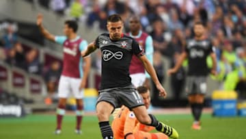 LONDON, ENGLAND - SEPTEMBER 25: Dusan Tadic of Southampton (11) beats Adrian of West Ham United as he scores their second goal during the Premier League match between West Ham United and Southampton at London Stadium on September 25, 2016 in London, England. (Photo by Shaun Botterill/Getty Images)