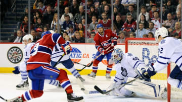 MONTREAL, CANADA - OCTOBER 22: Mike Cammalleri #13 misses a shot on net on a pass by teammate Brian Gionta #21 of the Montreal Canadiens in front of Jonas Gustavsson #50 of the Toronto Maple Leafs during the NHL game at the Bell Centre on October 22, 2011 in Montreal, Quebec, Canada. (Photo by Richard Wolowicz/Getty Images)
