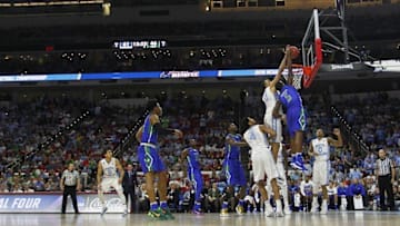 Mar 17, 2016; Raleigh, NC, USA; North Carolina Tar Heels forward Brice Johnson (11) blocks the shot of Florida Gulf Coast Eagles guard Zach Johnson (5) in the second half at PNC Arena. The Tar Heels won 83-67. Mandatory Credit: Geoff Burke-USA TODAY Sports